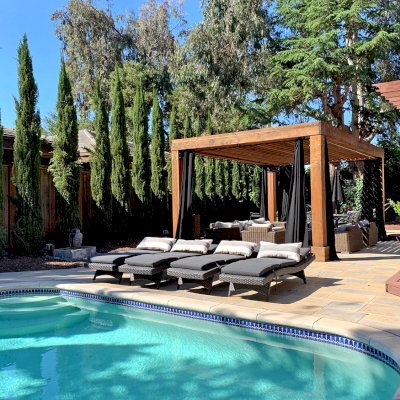 Silverado Modern Pergola (Options: 7 1/4" x 7 1/4" Post Thickness, Standard Roof Style, 20'L x 14'W, No Privacy Panels, California Redwood, No Rain Guard, 9ft Post Height, No Electrical Wiring Trim, 4 Post Anchor Kit for Concrete, 4 Curtain Rods, No Ceiling Fan Base, Transparent Premium Sealant). Photo Courtesy of B. Walsh of Atherton, California.