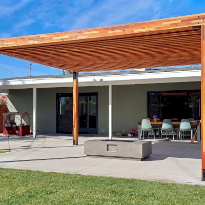 Silverado Modern Pergola (Options: 16' L, 14' W, Mosaic Redwood, 1 Electrical Wiring Trim, Standard Roof Style, Roof Rafter Spacing at 6", 4 Post Anchor Kit for Concrete, No Privacy Panels, No Curtain Rods, 9' Post Height, Transparent Premium Sealant). Photo Courtesy of C. Rolls of Ventura, CA.