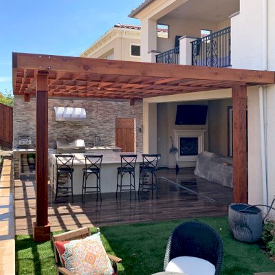Custom Attached Silverado Modern Pergola (Options: 22' L, 16'-6" W, Cantilevered Roof Style, 12" Roof Rafter Spacing, Mature Redwood, 1 Ceiling Fan Base, 2-Post Anchor kit for High-Wind, Transparent Premium Sealant). Photo Courtesy of J. Steiner of San Ramon, CA.