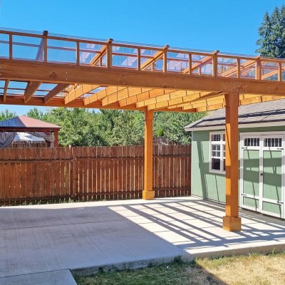 Custom Silverado Modern Pergola (Options: 20' L x 16' W, Cantilevered Roof Style, Douglas-fir, with Rain Guard, 2x10 Supports, 8x8 Posts, 4-Post Anchor Kit for Concrete, Transparent Premium Sealant). Photo Courtesy of K. Chan of Vancouver, WA.