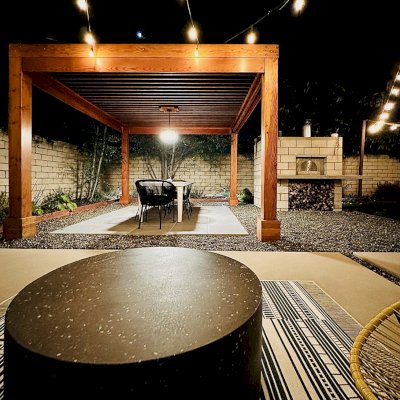 Silverado Modern Pergola (Options: 12' L, 14' W, 8x8 Posts, Standard Roof Style, Douglas-fir, Electrical Wiring Trim for 1 Post, Roof Rafter Spacing at 6", Post Anchor Kit for Concrete, No Privacy Panels, 1 Curtain Rods, 9' Post Height, Transparent Premium Sealant). Photo Courtesy of M. Dunn of Costa Mesa, CA.