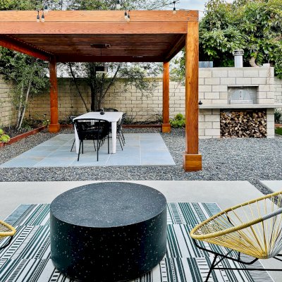 Silverado Modern Pergola (Options: 12' L, 14' W, 8x8 Posts, Standard Roof Style, Douglas-fir, Electrical Wiring Trim for 1 Post, Roof Rafter Spacing at 6", Post Anchor Kit for Concrete, No Privacy Panels, 1 Curtain Rods, 9' Post Height, Transparent Premium Sealant). Photo Courtesy of M. Dunn of Costa Mesa, CA.