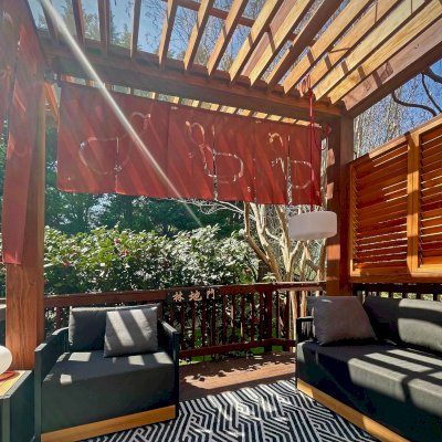 Silverado Modern Pergola (Options: 12' L, 12' W, Douglas-fir, Cantilevered Roof Style, with Transparent Rain Guard, 2 Electrical Wiring Trims, 1 Louver Privacy Panel Half Height Without Wall, 7 1/4" x 7 1/4" Posts, Roof Rafter Spacing at 6", 6 Post Anchor Kit for High-Wind, No Privacy Panels, No Curtain Rods, 9.5' Post Height, Transparent Premium Sealant for Interior and Coffee-Stain Premium Sealant for Exterior). Photo Courtesy of N. Smirnova of North Potomac, Maryland.