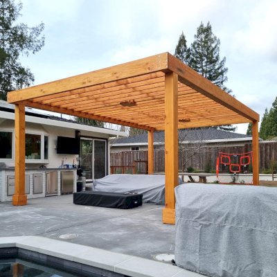 Custom Silverado Modern Pergola (Options: 20' L, 15' W, 8" Overhang on 2 Sides, Douglas-Fir, No Electrical Wiring Trim, with 1 1/2 x 11 1/4" Roof Support Timbers and 7 1/4" x 7 1/4" Posts, Roof Rafter Spacing at 12", 4 Post Anchor Kit for High-Wind, No Privacy Panels, No Curtain Rods, 10' Post Height, Transparent Premium Sealant). Photo Courtesy of S. Mchugh of Danville, CA.