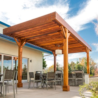 Silverado Modern Pergola (Options: 20' L, 12' W, Cantilevered Roof Style, Douglas-fir, 1 Electrical Wiring Trim, 7 1/4" x 7 1/4" Posts, No Privacy Panels, No Curtain Rods, 1 Ceiling Fan Base, 10' Post Height, Transparent Premium Sealant). Photo Courtesy of J. Holtfreter of San Jose, California.