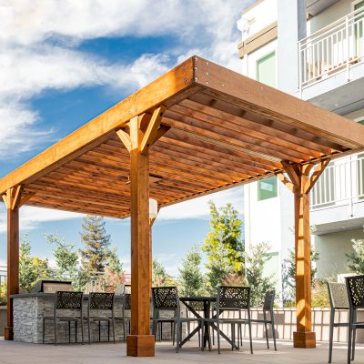Silverado Modern Pergola (Options: 20' L, 12' W, Cantilevered Roof Style, Douglas-fir, 1 Electrical Wiring Trim, 7 1/4" x 7 1/4" Posts, No Privacy Panels, No Curtain Rods, 1 Ceiling Fan Base, 10' Post Height, Transparent Premium Sealant). Photo Courtesy of J. Holtfreter of San Jose, California.