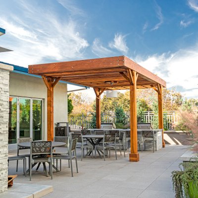 Silverado Modern Pergola (Options: 20' L, 12' W, Cantilevered Roof Style, Douglas-fir, 1 Electrical Wiring Trim, 7 1/4" x 7 1/4" Posts, No Privacy Panels, No Curtain Rods, 1 Ceiling Fan Base, 10' Post Height, Transparent Premium Sealant). Photo Courtesy of J. Holtfreter of San Jose, California.