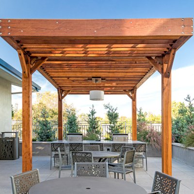 Silverado Modern Pergola (Options: 20' L, 12' W, Cantilevered Roof Style, Douglas-fir, 1 Electrical Wiring Trim, 7 1/4" x 7 1/4" Posts, No Privacy Panels, No Curtain Rods, 1 Ceiling Fan Base, 10' Post Height, Transparent Premium Sealant). Photo Courtesy of J. Holtfreter of San Jose, California.