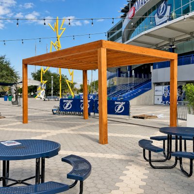 Silverado Modern Pergola (Options: 20' L, 20' W, Standard Roof Style, Douglas-fir, No Electrical Wiring Trim, 7 1/4" x 7 1/4" Posts, No Privacy Panels, No Curtain Rods, 9.5' Post Height, Transparent Premium Sealant). Photo Courtesy of The Tampa Bay Lightning NHL Team.