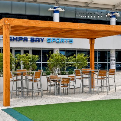 Silverado Modern Pergola (Options: 20' L, 20' W, Standard Roof Style, Douglas-fir, No Electrical Wiring Trim, 7 1/4" x 7 1/4" Posts, No Privacy Panels, No Curtain Rods, 9.5' Post Height, Transparent Premium Sealant). Photo Courtesy of The Tampa Bay Lightning NHL Team.
