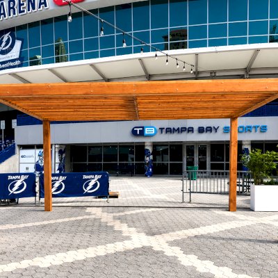 Silverado Modern Pergola (Options: 20' L, 20' W, Standard Roof Style, Douglas-fir, No Electrical Wiring Trim, 7 1/4" x 7 1/4" Posts, No Privacy Panels, No Curtain Rods, 9.5' Post Height, Transparent Premium Sealant). Photo Courtesy of The Tampa Bay Lightning NHL Team.