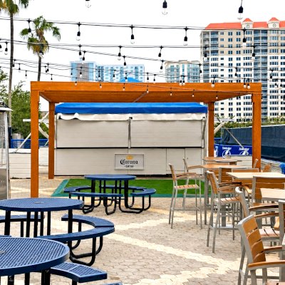 Silverado Modern Pergola (Options: 20' L, 20' W, Standard Roof Style, Douglas-fir, No Electrical Wiring Trim, 7 1/4" x 7 1/4" Posts, No Privacy Panels, No Curtain Rods, 9.5' Post Height, Transparent Premium Sealant). Photo Courtesy of The Tampa Bay Lightning NHL Team.