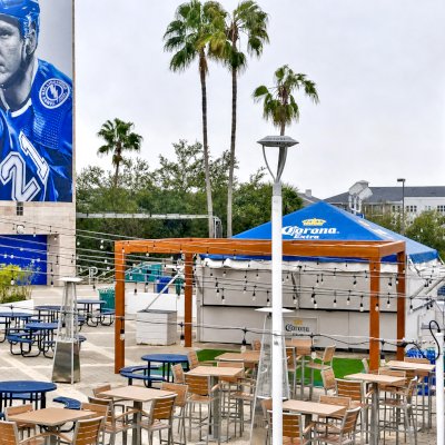 Silverado Modern Pergola (Options: 20' L, 20' W, Standard Roof Style, Douglas-fir, No Electrical Wiring Trim, 7 1/4" x 7 1/4" Posts, No Privacy Panels, No Curtain Rods, 9.5' Post Height, Transparent Premium Sealant). Photo Courtesy of The Tampa Bay Lightning NHL Team.