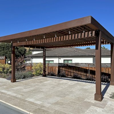 Silverado Modern Pergola (Options: 20' L, 15' W, Cantilevered Roof Style, California Redwood, No Electrical Wiring Trim, with 1 3/4" x 9 1/4" Roof Support Timbers and 7 1/4" x 7 1/4" Posts, Roof Rafter Spacing at 6", 4 Post Anchor Kit for High-Wind, No Privacy Panels, 3 Curtain Rods, 10' Post Height, Coffee-Stain Premium Sealant). Photo Taken 2 Years After Installation. Photo Courtesy of V. Weld of Morgan Hill, CA. 