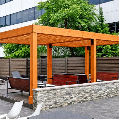 Silverado Modern Pergola (Options: 15' L, 22' W, Cantilevered Roof Style, Douglas-fir, No Electrical Wiring Trim, with 1 3/4" x 11 1/4" Roof Support Timbers and 7 1/4" x 7 1/4" Posts, Roof Rafter Spacing at 6", 6 Post Anchor Kit for High-Wind, No Privacy Panels, No Curtain Rods, 9' Post Height, Transparent Premium Sealant). Photo Courtesy of M. Zahler of Fort Lee, NJ.