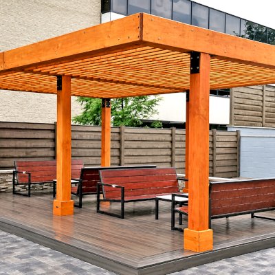 Silverado Modern Pergola (Options: 15' L, 22' W, Cantilevered Roof Style, Douglas-fir, No Electrical Wiring Trim, with 1 3/4" x 11 1/4" Roof Support Timbers and 7 1/4" x 7 1/4" Posts, Roof Rafter Spacing at 6", 6 Post Anchor Kit for High-Wind, No Privacy Panels, No Curtain Rods, 9' Post Height, Transparent Premium Sealant). Photo Courtesy of M. Zahler of Fort Lee, NJ.