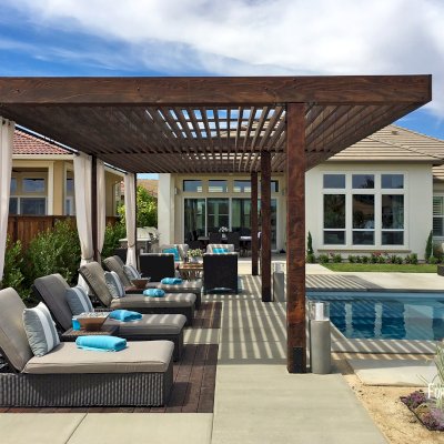 Silverado Modern Pergola (Options: 30'-8" L, 16' W, Cantilevered Roof Style, California Redwood, No Electrical Wiring Trim, with 1 3/4" x 11 1/4" Roof Support Timbers and 7 1/4" x 7 1/4" Posts, Roof Rafter Spacing at 6", 6 Post Anchor Kit for High-Wind, No Privacy Panels, No Curtain Rods, 10' Post Height, Coffee-Stain Premium Sealant). Photo Courtesy of B. Aronson of Lincoln, CA.