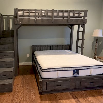 Stairway Bunk Sets (Options: Twin Top Bed, Queen Bottom Bed, Redwood, Stairway with Drawers on South and Ladder on North, Standard Headboard, Add 2 Drawers to Bottom Bed, Standard Safety Rails, Custom Stain). Photo Courtesy of M. Ocadiz of Glenwood, Maryland.
