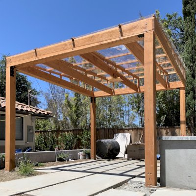 Sun Pergola (Options: 10' L x 10' W, With Rainguard, No Privacy Panel, Douglas Fir, No Curtain Rods, 1 Ceiling Fan Base, 10.5 ft Posts Height, Electrical Wiring Trim Kit for 4 Posts, Post Anchor Kit for High-Wind, Transparent Premium Sealant).