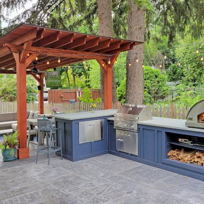 Sunset Patio Pavilion (Options: 22' x 12', No Privacy Panel, Douglas-fir, 10ft H, No Electrical Wiring Trim, 4-Post Anchor Kit for Concrete, No Post Decorative Trim, No Ceiling Fan Base, No Curtain Rods, Cherry Stain Premium Sealant). Photo Courtesy of J. Osborne of Saratoga Springs, NY.
