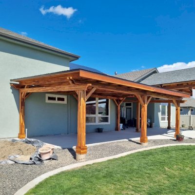 Sunset Patio Pavilion (Options: 28' x 17', Mosaic Redwood, Custom Post Height, 1 Electrical Wiring Trim, 6-Post Anchor Kit for High-Wind, No Post Decorative Trim, 2 Ceiling Fan Bases, No Curtain Rods, Transparent Premium Sealant). Photo Courtesy of M. Neideffer of Star, ID.