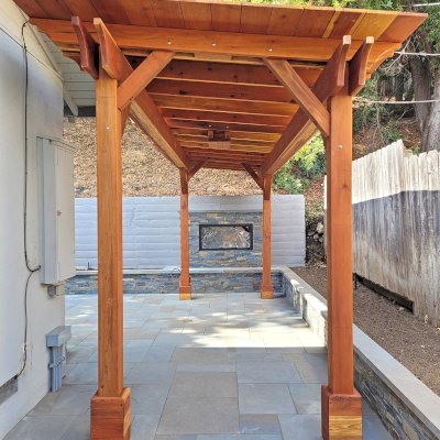 Sunset Patio Pavilion (Options: 8' x 24', No Privacy Panel, California Redwood, 9ft H, No Electrical Wiring Trim, 4-Post Anchor Kit for High-Wind, No Post Decorative Trim, 1 Ceiling Fan Base, No Curtain Rods, Transparent Premium Sealant). Photo Courtesy of M. Horn of Redwood City, CA.