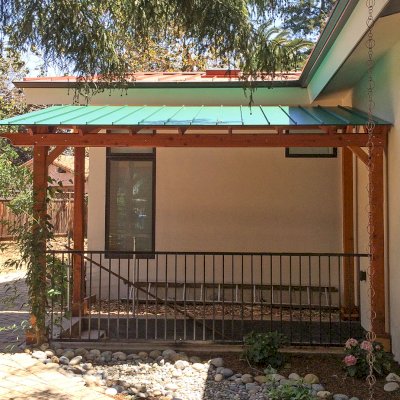 Sunset Patio Pavilion (Options: 16' L x 9' W, No Privacy Panels, California Redwood, 9ft H, No Electrical Wiring Trim, 4-Post Anchor Kit for Concrete, No Post Decorative Trim, No Ceiling Fan Base, No Curtain Rods, Transparent Premium Sealant). Photo Courtesy of S. Aber.