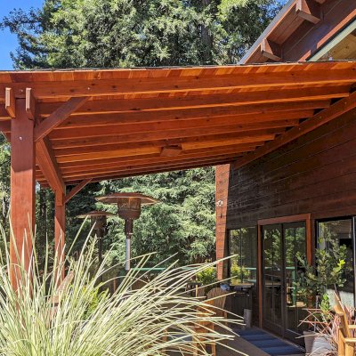Sunset Porch Pavilion (Options: 18' L x 15' W, California Redwood, Attached to House, 22ft H Posts [From Ground to Tall Deck] by Custom Request, No Electrical Wiring Trim, 2-Post Anchor Kit for Concrete, No Post Decorative Trim, No Ceiling Fan Base, No Curtain Rods, Transparent Premium Sealant). Photo Courtesy of L. Draper of Aptos, California.