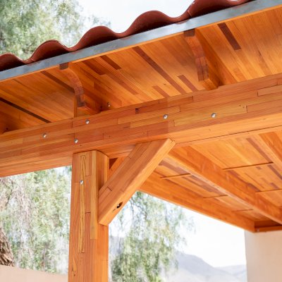 Sunset Porch Pavilion (Options: 20' x 12', Posts and Roof Timbers are Mosaic Douglas-Fir, Parquet Roofing is Mosaic Redwood, 8ft H, No Electrical Wiring Trim, 2-Post Anchor Kit for Concrete, No Post Decorative Trim, No Ceiling Fan Base, No Curtain Rods, Transparent Premium Sealant). Internal Ceiling is Our New Parquet Roofing Finish in California Redwood.