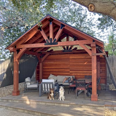 Thick Timber Toledo Wood Pavilion (Options: 12' L x 16' W, California Redwood, 4-Post Anchor Kit for High-Wind, No Curtain Rods, 3 Electrical Wiring Trims, 8 x 8 Supports, Rafters and Posts, 1 Solid Privacy Panel, Cherry Stain Premium Sealant). Photo Courtesy of L. Sasscer of San Jose, CA.