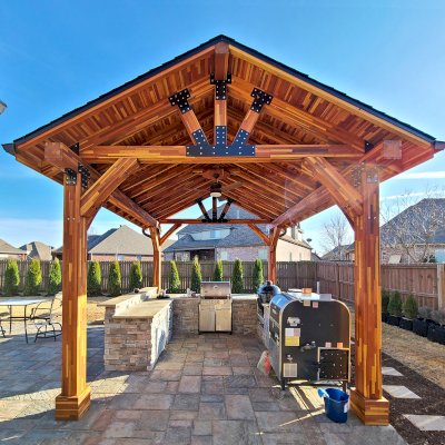 Thick Timber Toledo Wood Pavilions  (Options: 16' L x 14' W, Mosaic Redwood, 4-Post Anchor Kit for High-Wind, Electrical Wiring Trim for 1 Post, 8 x 8 Supports and Posts, 8 x 8 Rafters, 1 Fan Base, Transparent Premium Sealant). Photo Courtesy of A. Shaver of Rogers, Arkansas.