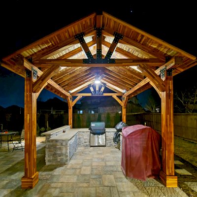 Thick Timber Toledo Wood Pavilion  (Options: 16' L x 14' W, Mosaic Redwood, 4-Post Anchor Kit for High-Wind, Electrical Wiring Trim for 1 Post, 8 x 8 Supports and Posts, 8 x 8 Rafters, 1 Fan Base, Transparent Premium Sealant). Photo Courtesy of A. Shaver of Rogers, Arkansas.