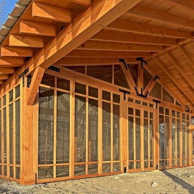 Thick Timber Toledo Wood Pavilions  (Options: 33' L x 33' W, Douglas-fir, 6-Post Anchor Kit for High-Wind, Electrical Wiring Trim for 2 Posts, 8 x 8 Supports and Rafters, 8 x 8 Posts, No Fan Base, with Screening Panels by Custom Request, Transparent Premium Sealant). Photo Courtesy of C. Segal of East Troy, WI.