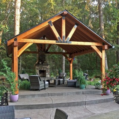Thick Timber Toledo Wood Pavilion (Options: 20' L x 20' W, Douglas-fir, 4-Post Anchor Kit for Concrete, 8' H Posts, No Electrical Wiring Trim, 8 x 8 Posts and Trusses, 8 x 10 Supports, 2 x 8 Rafters, No Fan Bases, Transparent Premium Sealant). Photo Courtesy of B. Read of Grants Pass, Oregon.