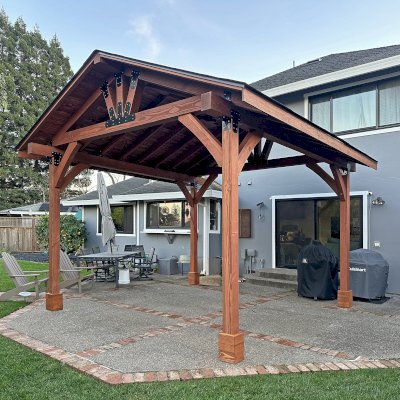 Thick Timber Toledo Wood Pavilion (Options: 16' L x 16' W, Douglas-fir, Custom Anchors, No Electrical Wiring Trim, 6 x 8 Supports, 6 x 6 Posts and Rafters, No Fan Base, Transparent Premium Sealant). Photo Courtesy of B. Hurrell of Novato, CA.