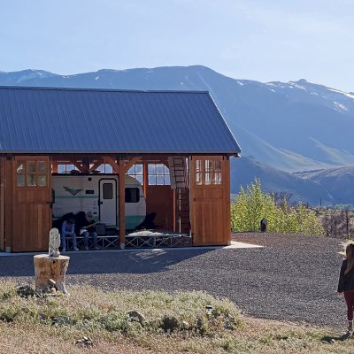 Thick Timber Toledo Wood Pavilions (Options: 28' L x 24' W, Douglas-fir, Post Anchor Kit for High-Wind, No Electrical Wiring Trims, 8 x 8 Supports and Rafters, 8 x 8 Posts, No Fan Bases, with Custom Sliding Barn Doors, Transparent Premium Sealant). Photo Courtesy of Paul & Caren Kamanski of Coleville, CA.