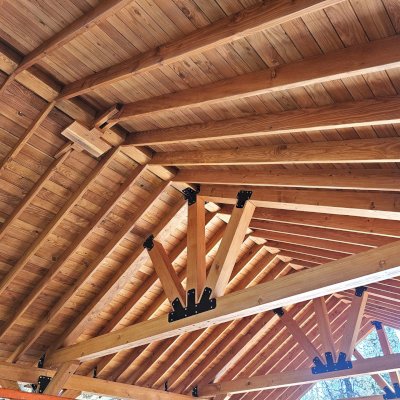 Thick Timber Toledo Wood Pavilion (Options: 40' L x 24' W, Douglas-fir, Post Anchor Kit for High-Wind, 9' H Posts, 2 Electrical Wiring Trims, 8 x 8 Posts, 8x10 Supports, 8x10 Bottom Chord and 8x8 Top Chord, 2x8 Rafters, 2 Fan Bases, Transparent Premium Sealant). Photo Courtesy of D. Stone of Fairfield, ID.