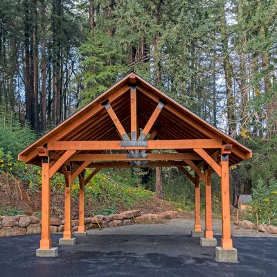 Thick Timber Toledo Wood Pavilions  (Options: 27' L x 25' W, Douglas-fir, 6-Post Anchor Kit for High-Wind, No Electrical Wiring Trims, 10 x 10 Supports and Posts, 8 x 8 Rafters [8 x 12 Bottom Chord], No Fan Base, Transparent Premium Sealant). Photo Courtesy of M. Prosise of Napa, California.