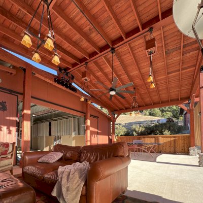 Custom Thick Timber Toledo Wood Pavilion (Options: 20' L x 33' W, Douglas-fir, with 2 Fascia Boards, Custom Roof Pitch, 10' H Posts, with 8 Posts by Custom Request, Coffee-Stain Premium Sealant). Photo Courtesy of P. Bierwith of San Ramon, CA.