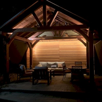 Thick Timber Toledo Wood Pavilion (Options: 12' L x 16' W, California Redwood, 4-Post Anchor Kit for High-Wind, No Curtain Rods, 3 Electrical Wiring Trims, 8 x 8 Supports, Rafters and Posts, 1 Solid Privacy Panel, Cherry Stain Premium Sealant). Photo Courtesy of L. Sasscer of San Jose, CA.