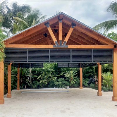 Thick Timber Toledo Wood Pavilion  (Options: 20' L x 20' W, California Redwood, 6-Post Anchor Kit for High-Wind, No Electrical Wiring Trim, 8 x 8 Supports and Posts, 8 x 8 Rafters, No Fan Base, With Custom Bahama Shutters, Transparent Premium Sealant). 