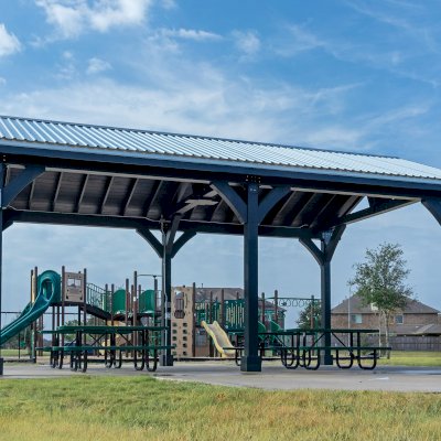 Thick Timber Toledo Wood Pavilion (Options: 30' L x 18' W, Douglas-fir, 6-Post Anchor Kit for High-Wind, No Curtain Rods, 1 Electrical Wiring Trim, 8 x 8 Supports, Rafters and Posts, Black Stain Premium Sealant). Photo Courtesy of T. Harris of Katy, TX.