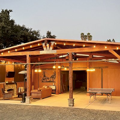 Custom Thick Timber Toledo Wood Pavilion (Options: 20' L x 33' W, Douglas-fir, with 2 Fascia Boards, Custom Roof Pitch, 10' H Posts, with 8 Posts by Custom Request, Coffee-Stain Premium Sealant). Photo Courtesy of P. Bierwith of San Ramon, CA.