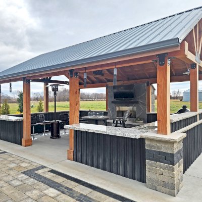 Thick Timber Toledo Wood Pavilion (Options: 26.5' L x 18.5' W, Douglas-fir, Post Anchor Kit for Concrete, 10' H Posts, No Electrical Wiring Trims, 8 x 8 Posts, 8 x 12 Supports, 6 x 8 Trusses, 2 Fan Bases, Custom Finish). Photo Courtesy of E. Moraniec of Iowa City, Iowa.