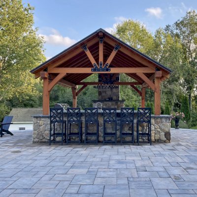 Thick Timber Toledo Wood Pavilion (Options: 20' L x 16' W, Douglas-fir, 8' H Posts, 4-Post Anchor Kit for High-Wind, Transparent Premium Sealant). Photo Courtesy of J & B Laperle of Auburn, MA.