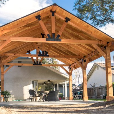 Thick Timber Toledo Wood Pavilions  (Options: 27' L x 25' W, Douglas-fir, 6-Post Anchor Kit for High-Wind, Electrical Wiring Trim for 2 Posts, 8 x 8 Supports and Rafters, 10 x 10 Posts, 2 Fan Bases, Transparent Premium Sealant). Photo Courtesy of T. Lane of Kingsburg, CA.