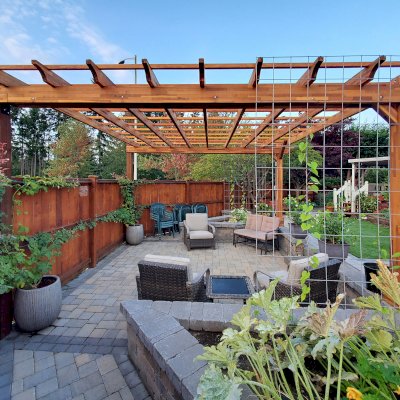 Traditional Wooden Garden Pergola (Options: 16' L x 16' W, Mosaic Redwood, Electrical Wiring Trim for 1 Post, Open Roof with Slats at 18", Rafters at 18", 2-Post Anchor Kit for Concrete, No Ceiling Fan Base, No Privacy Panels, No Curtain Rods, 9' Posts, Transparent Premium Sealant). 2 Back Posts Already Existing On Site. Photo Courtesy of J. Hawkes of Lacey, WA.