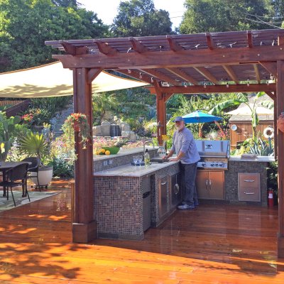 Traditional Wooden Garden Pergola (Options: 14' L x 11' W, Mature Redwood, Electrical Wiring Trim for2 Posts, Open Roof with Slats at 6", Rafters at 18", 4-Post Anchor Kit for Wood, No Ceiling Fan Base, No Privacy Panels, Vertical Post Decorative Trims, No Curtain Rod, 9' Post Height, Transparent Premium Sealant). Photo Courtesy of J. Turner of Santa Barbara, California.