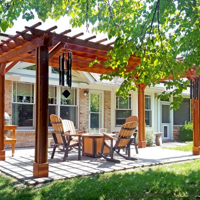 Traditional Wooden Garden Pergola (Options: 10' L x 20' W, California Redwood, No Electrical Wiring Trim, Open Roof with Slats at 12", Rafters at 18", 4-Post Anchor Kit for Concrete, Vertical Post Decorative Trim, No Ceiling Fan Base, No Privacy Panels, No Curtain Rods, Transparent Premium Sealant). Photo Courtesy of J. Karibian of Saint Charles, Missouri.