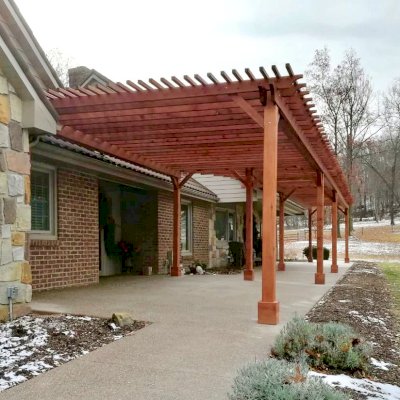 Traditional Wooden Garden Pergola (Options: 22' L x 14.5' W & 42' L x 8' W [Connected], Mature Redwood, No Electrical Wiring Trim, Open Roof with Slats at 18", Rafters at 18", Lengthwise Roof Support Timbers, 9-Post Anchor Kit for Stone, No Ceiling Fan Base, No Privacy Panels, No Curtain Rods, 9.5' Post Height, Transparent Premium Sealant). Photo Courtesy of K. Feliciani of Greensburg, Pennsylvania.